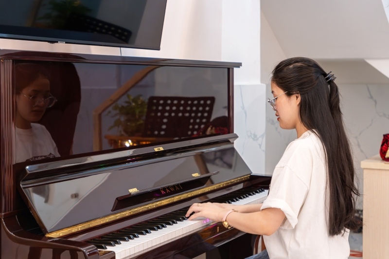 Bàn giao piano cơ Kawai BL61 Mahogany tại Quận 8