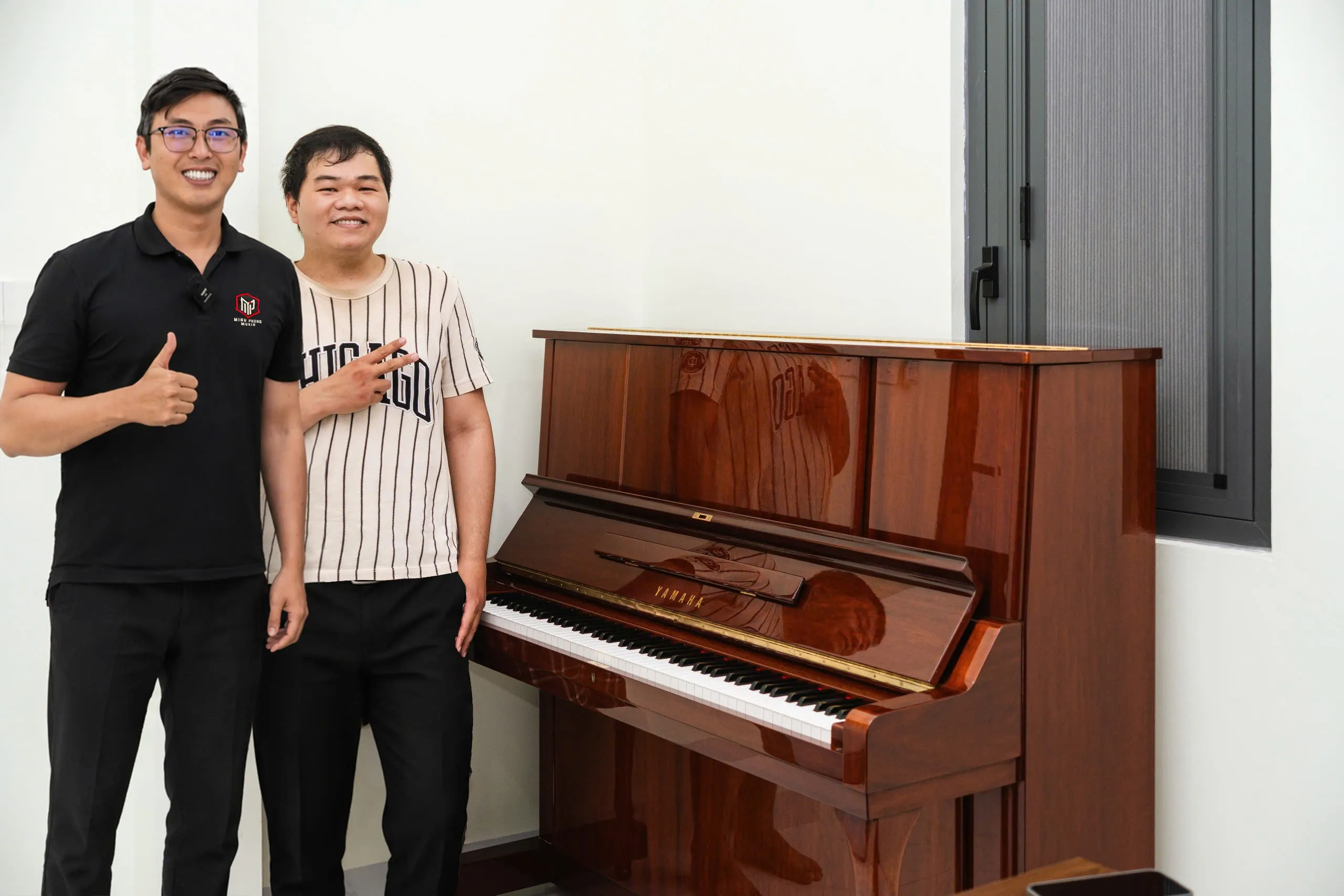 Bàn giao piano cơ Yamaha W106B về Quận 12, TP.HCM - 1